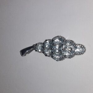 Sky blue topaz pendant in stainless steel.